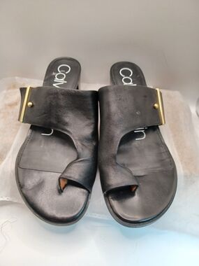 Calvin Klein  Size 6 Black Leather Slide Sandals with Gold Accent.